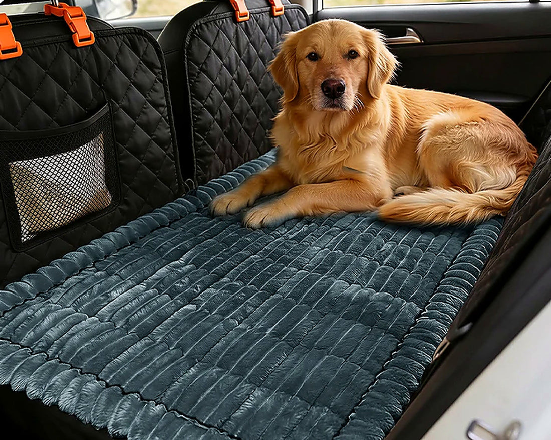 Golden retriever resting on a padded Ironbark Comfort Mat across a car's back seat