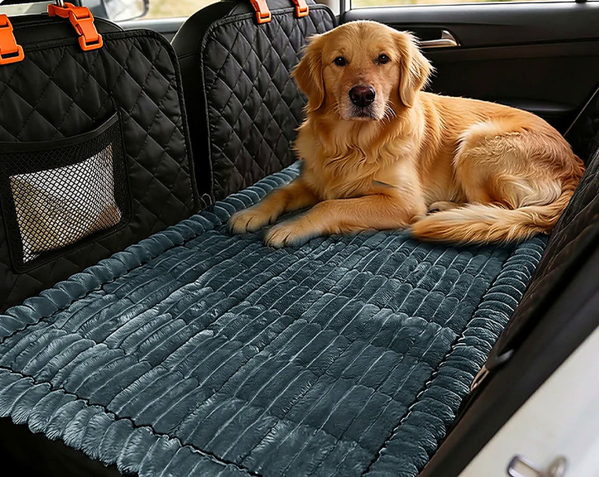 Golden retriever resting on a padded Ironbark Comfort Mat across a car's back seat