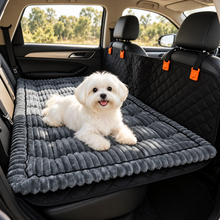 Small dog relaxing on the Ironbark RoadDeck Comfort Mat across a car back seat