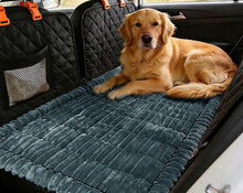Golden retriever resting on the Ironbark RoadDeck Comfort Mat in a car back seat