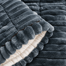 Close-up of the plush ribbed texture and padded construction of the Ironbark RoadDeck Comfort Mat